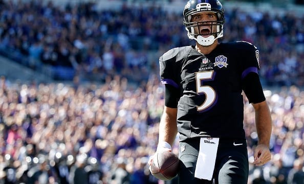Quarterback Joe Flacco #5 of the Baltimore Ravens celebrates after scoring a first quarter touchdown during a game against the Cleveland Browns
