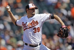 Baltimore Orioles starting pitcher Jason Hammel throws to the Minnesota Twin